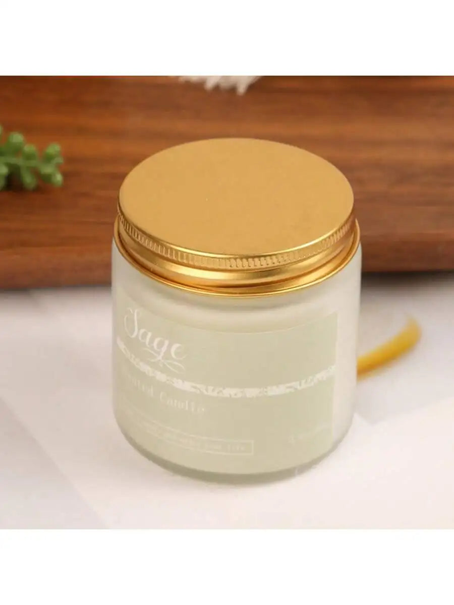Sage scented candle in a frosted glass jar with a metallic gold screw-top lid.