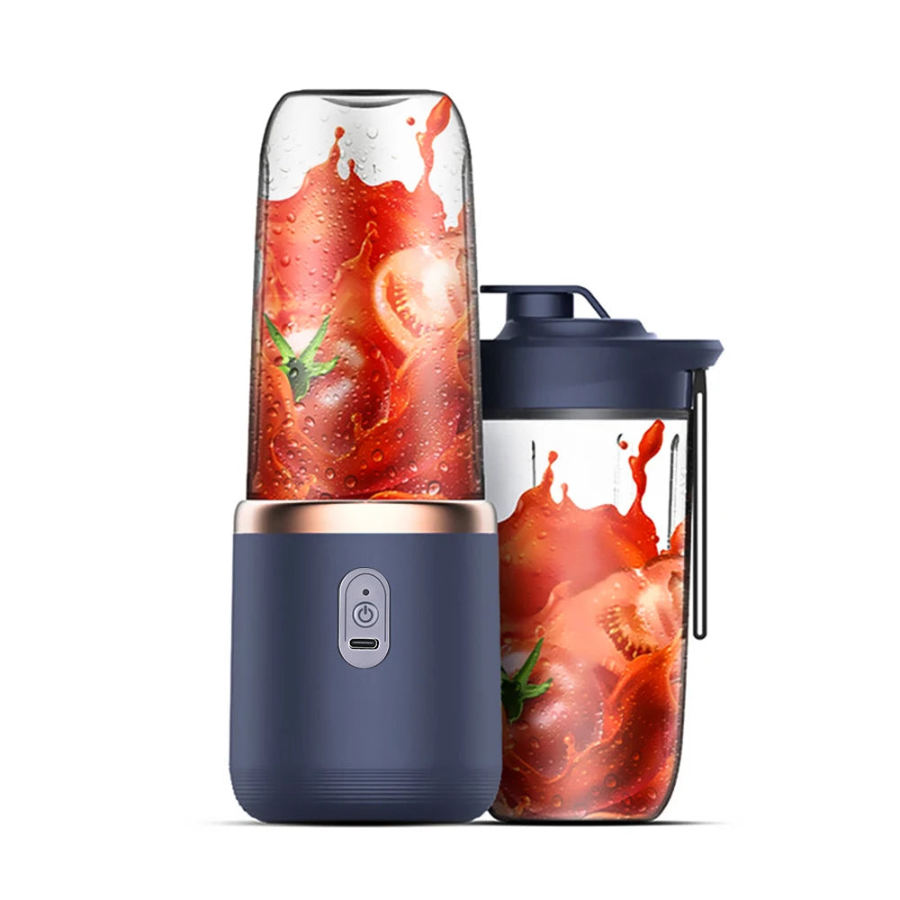 Portable matte navy blue personal blender with rose gold trim, containing a tomato-red smoothie.