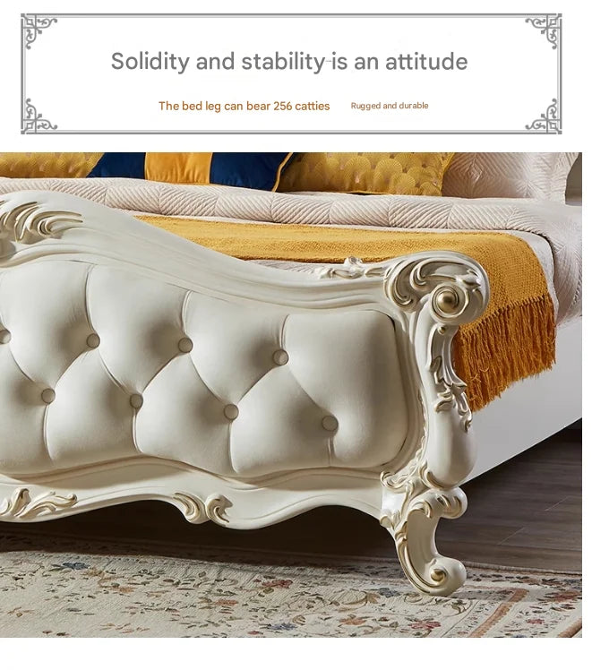 Cream-coloured luxury bed featuring a button-tufted headboard with ornate gold-accented, carved wooden detailing.