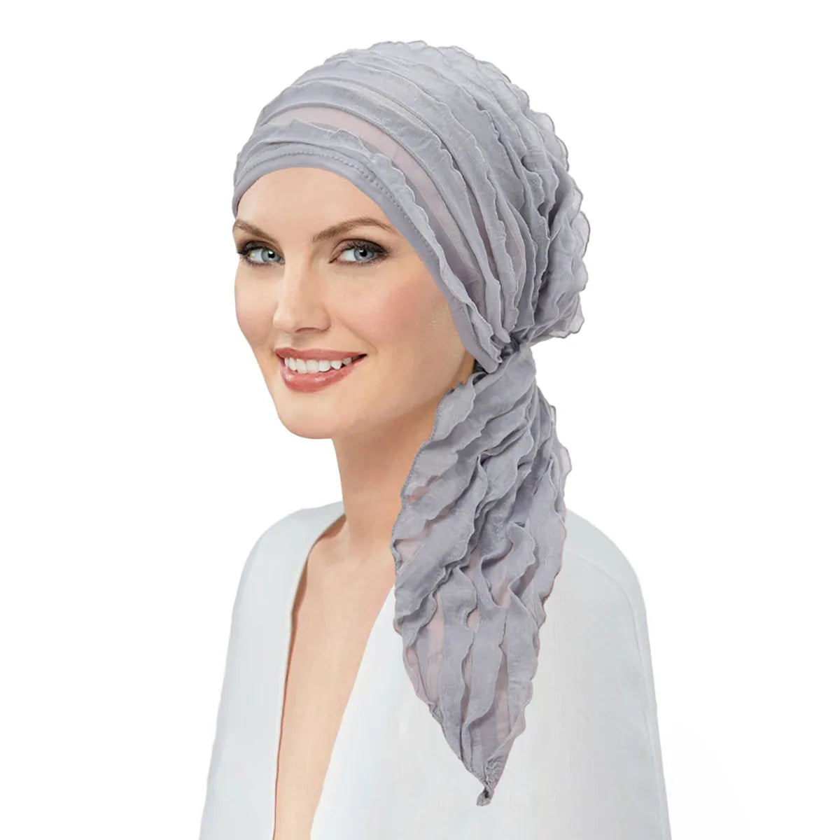A model wearing a grey, pre-tied ruffle turban head wrap with an elegant, textured drape.