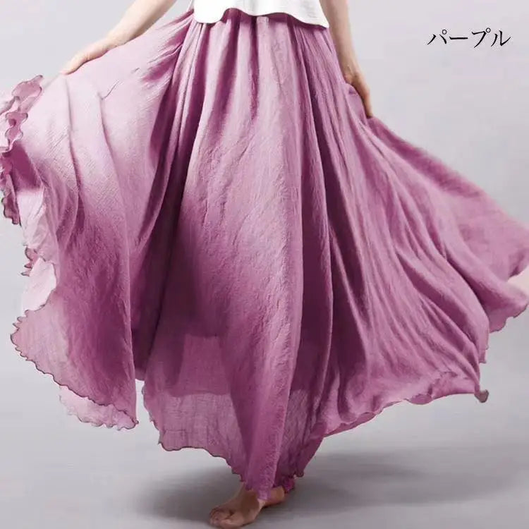 Flowing, high-waisted purple maxi skirt in a lightweight, crinkled fabric with a soft, flared silhouette.