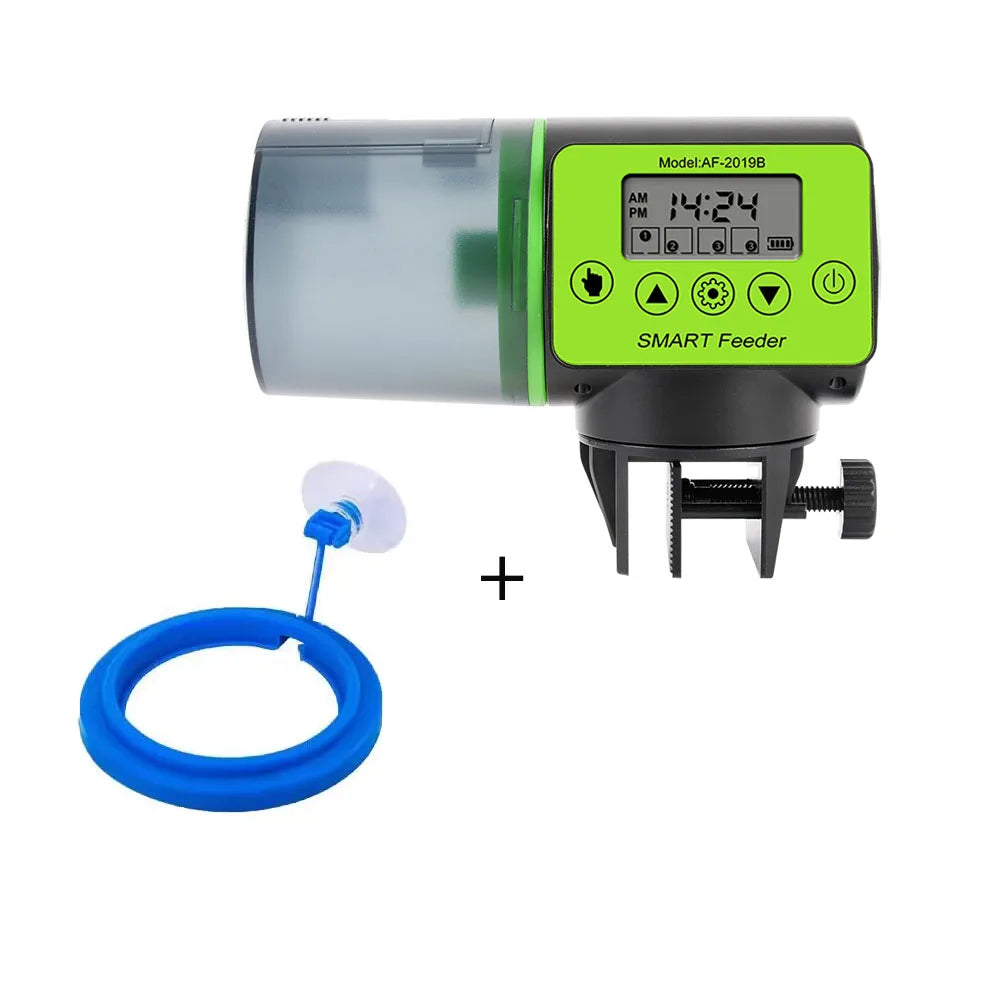 Automatic aquarium fish feeder with digital display, green and black housing, and a floating blue feeding ring.
