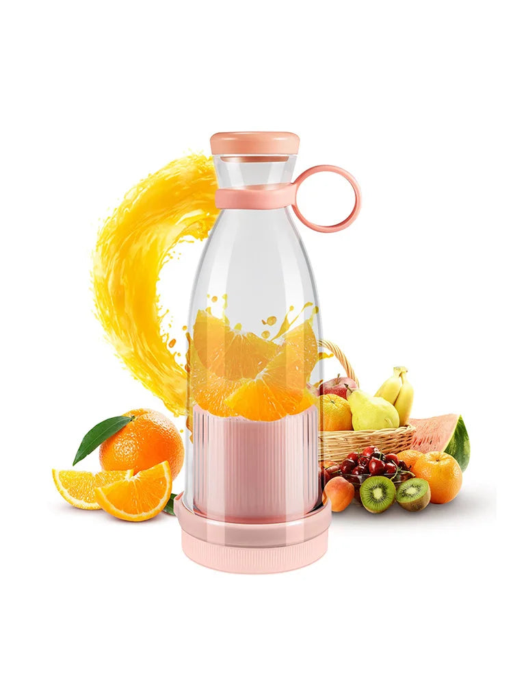 Portable pink blender bottle with a carry loop, surrounded by fresh oranges and various fruits.