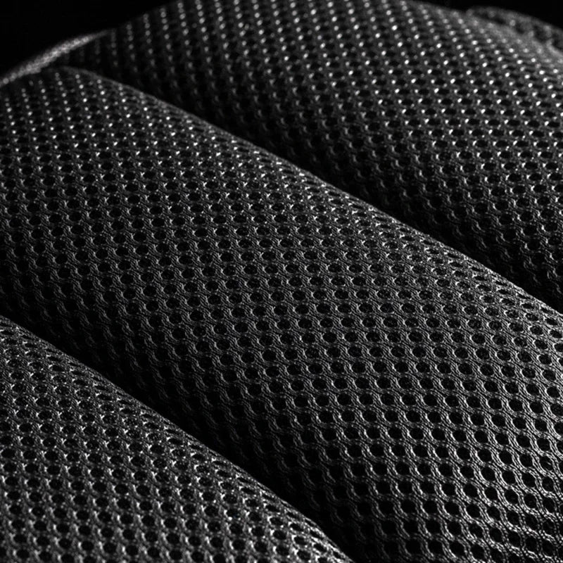 Close-up of black, breathable padded mesh fabric on the back of an anti-theft crossbody chest bag.