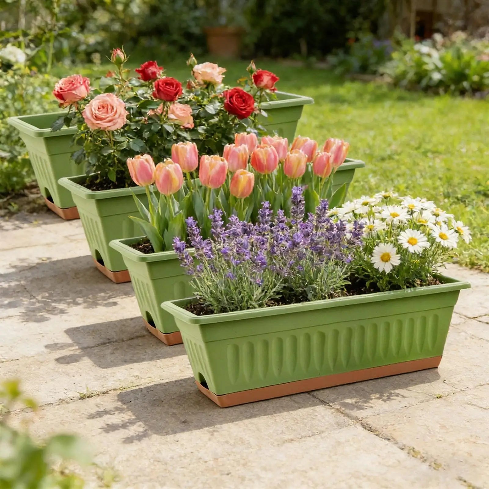 Four sage green rectangular planters with ribbed sides and terracotta bases, each filled with different colorful flowers.