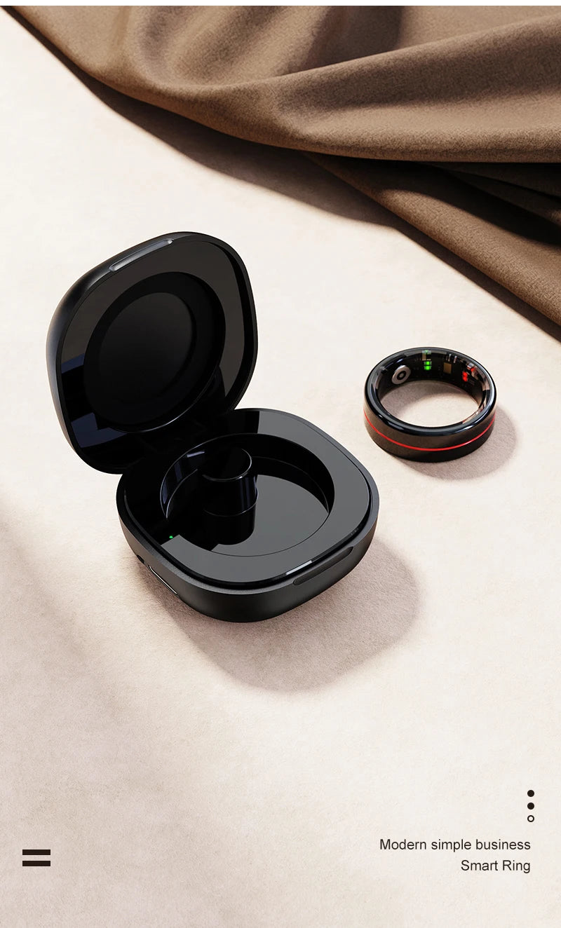 Sleek black health and fitness smart ring with red detail, shown beside its matching wireless charging case.