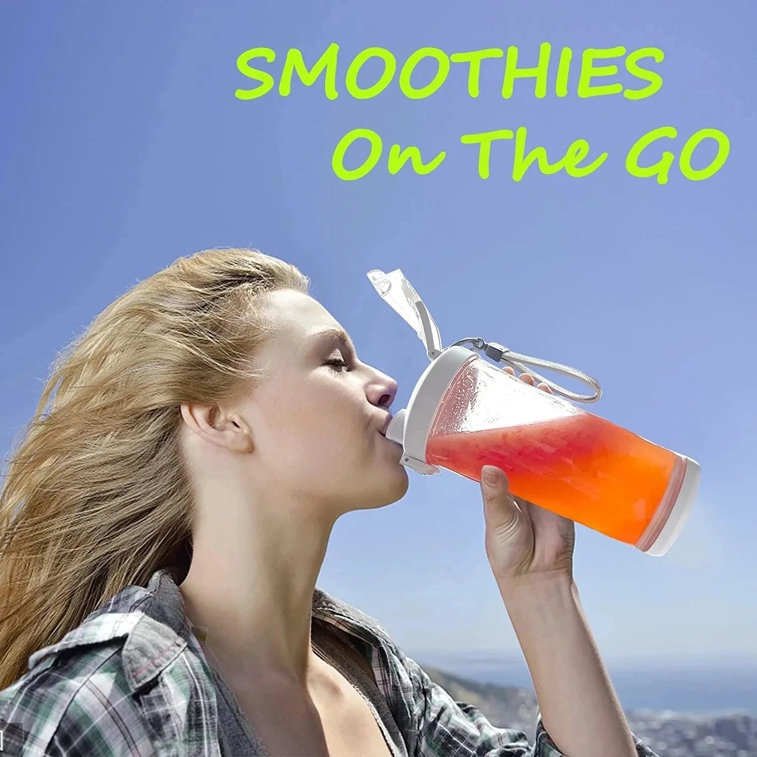 A woman drinking a bright orange smoothie from a clear, portable plastic bottle with a white flip-top lid.