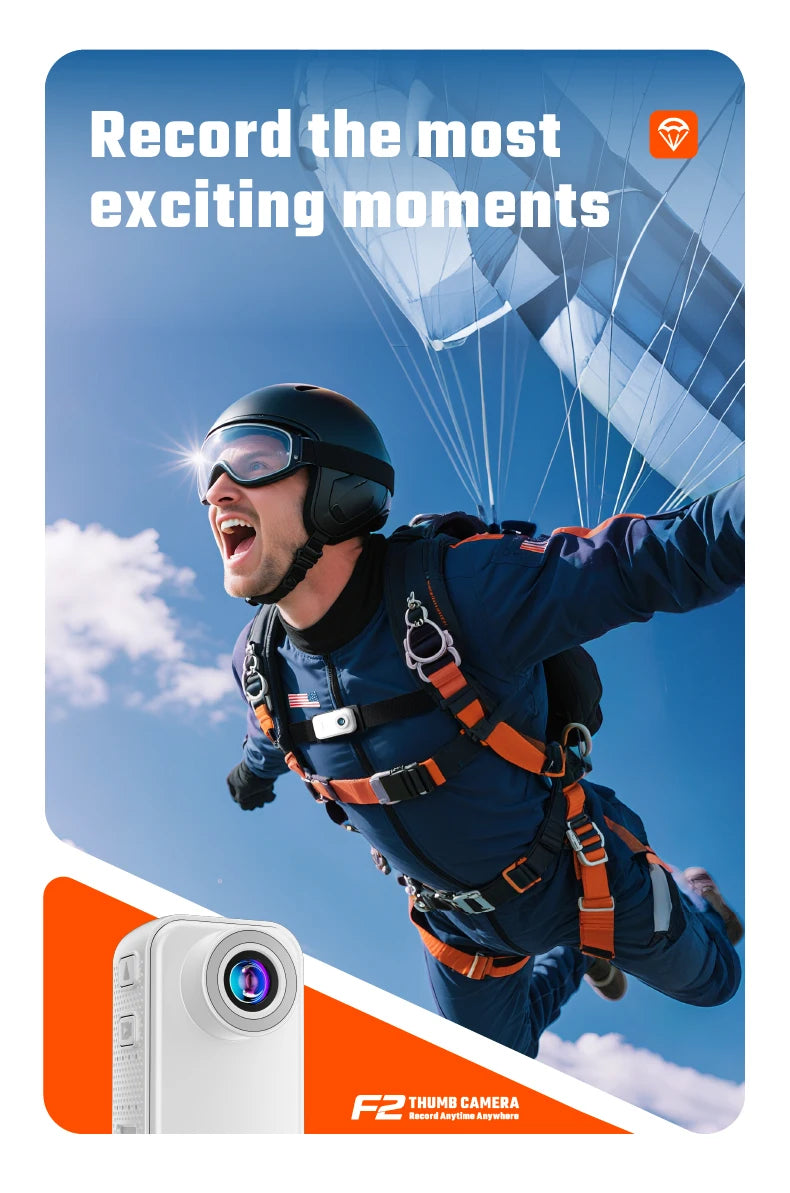 Small white, rectangular plastic thumb camera with a prominent lens, shown on a promotional poster with a skydiver.