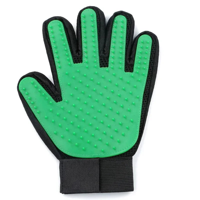 Green silicone pet grooming glove with black mesh backing and an adjustable wrist strap.
