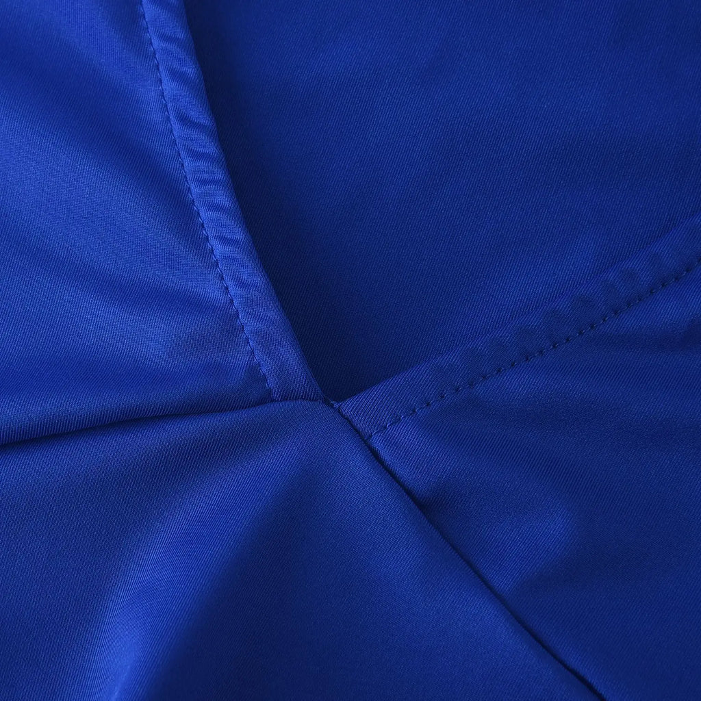 Close-up of royal blue bandage dress featuring textured fabric and clean stitched seams.