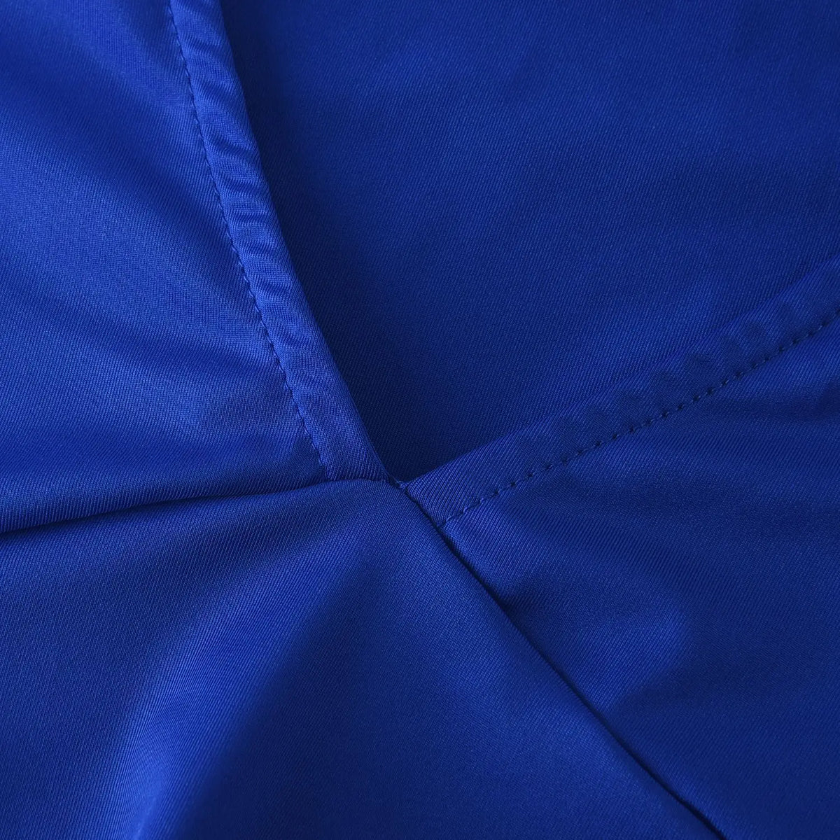 Close-up of royal blue bandage dress featuring textured fabric and clean stitched seams.