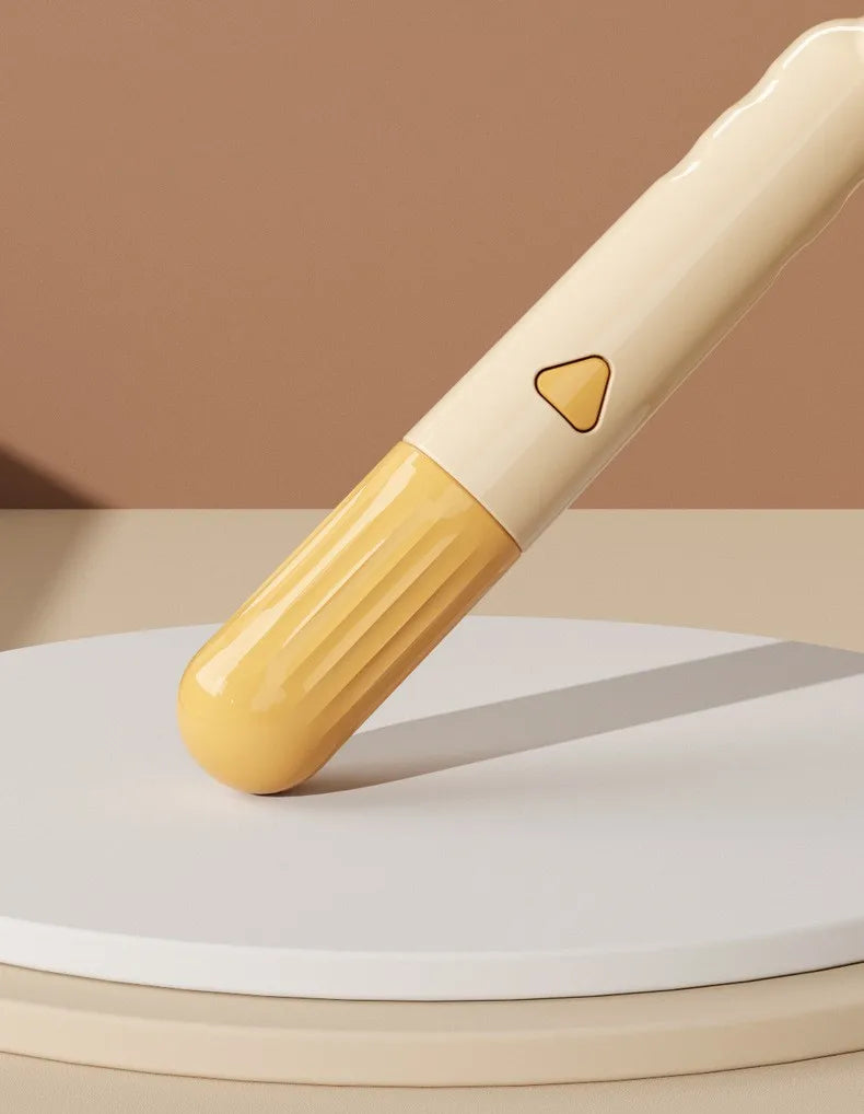 Cream and yellow electric facial cleanser device with a ribbed head and triangular button on a white display stand.