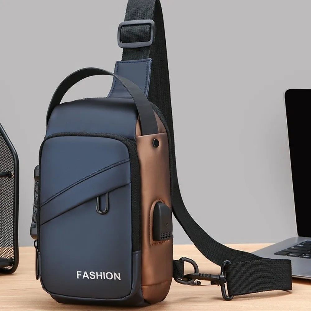 Navy and bronze anti-theft chest bag with adjustable strap, handle, and integrated USB charging port.