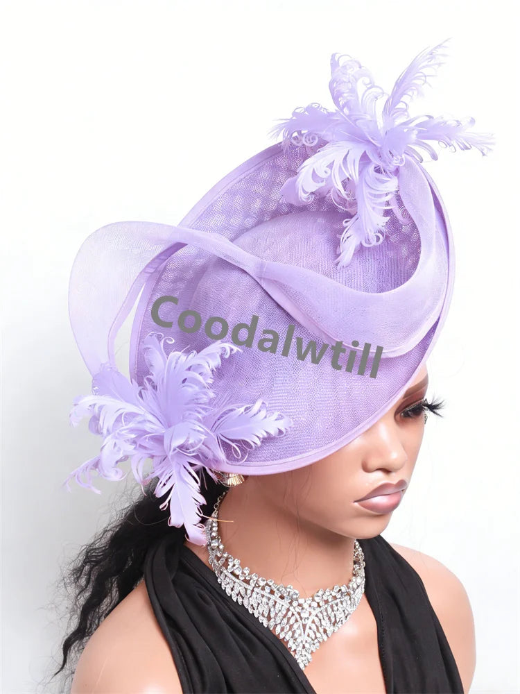 Elegant lilac fascinator headpiece in sinamay with decorative organza loops and delicate feather accents.