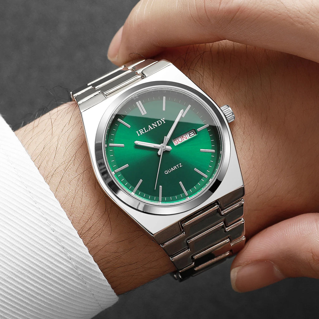 Luxury men's quartz wristwatch with a polished silver-tone stainless steel strap and a striking emerald green dial.