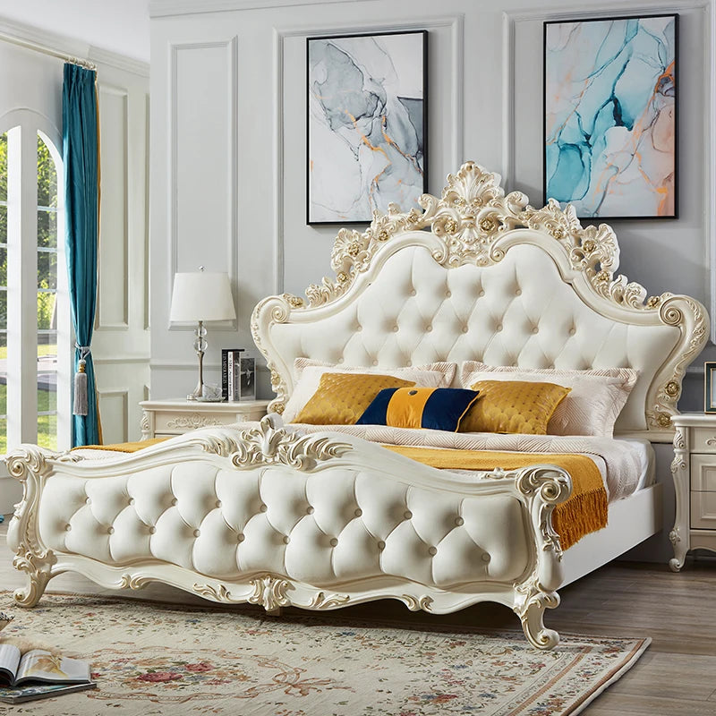 Luxury cream-coloured princess bed with ornate gold-detailed carved wood, tufted headboard, and footboard.