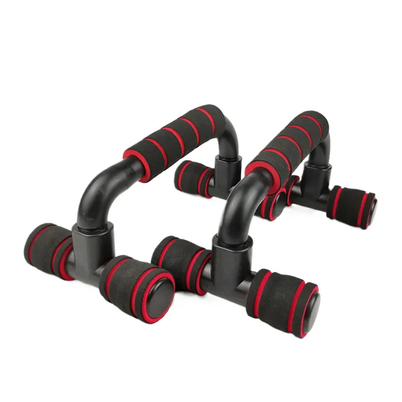 A pair of black and red foam-padded press-up bars for home fitness training.