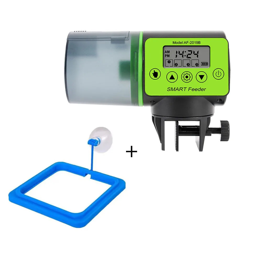 Digital automatic aquarium fish feeder with green control panel and a blue floating food ring on a white background.