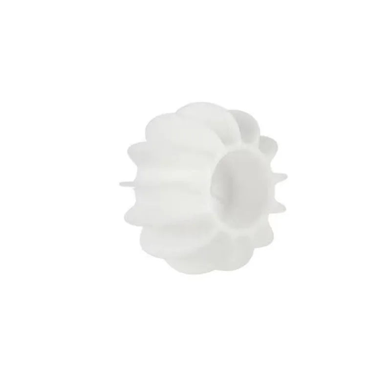 Small, white, fluted silicone mould for cupcake liners, isolated on a white background.