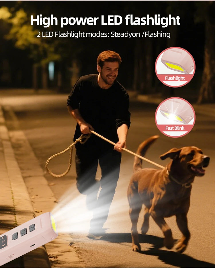 A white, handheld rechargeable dog training device featuring an LED torch with steady and flashing modes.