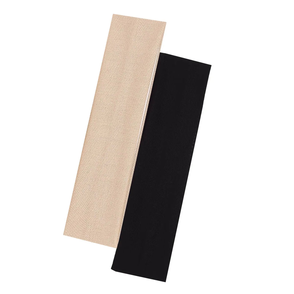 Two wide fabric headbands, one in beige and one in black, laid at an angle against a white background.