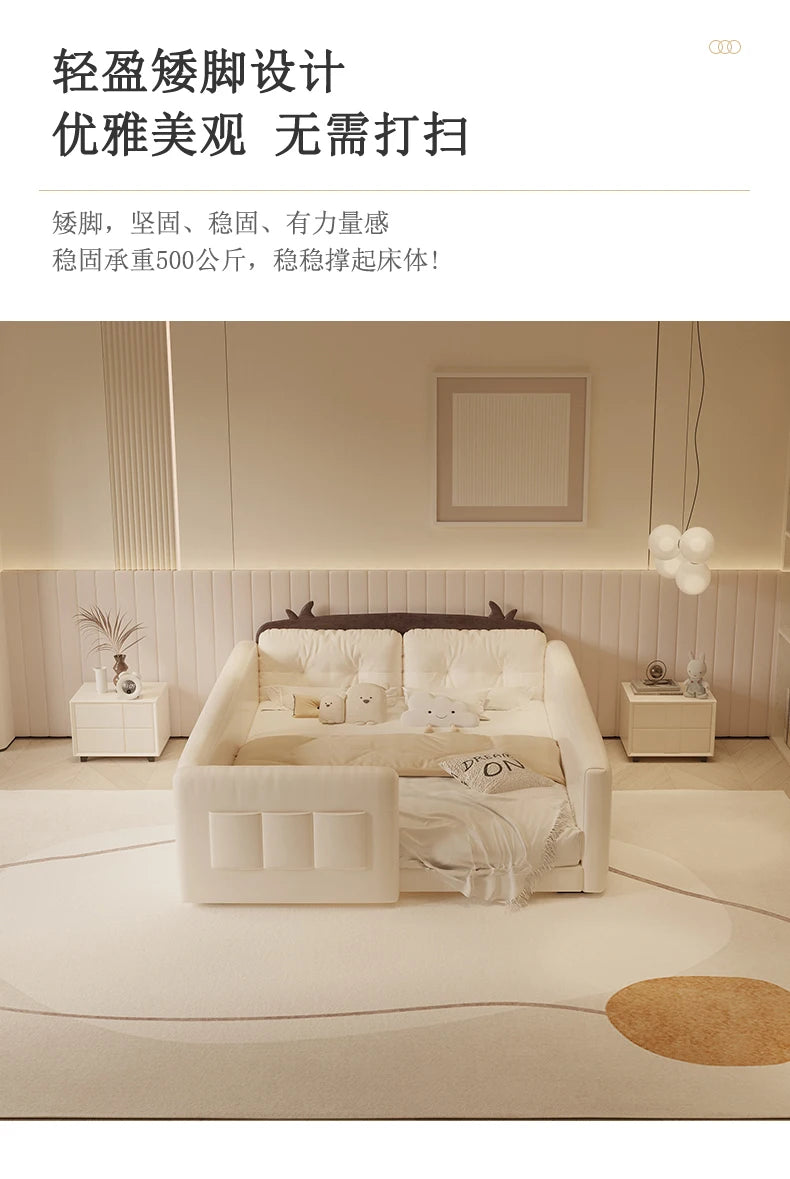 Cream-coloured parent-child bed featuring a playful cow-themed headboard, protective side guardrails, and soft styling.