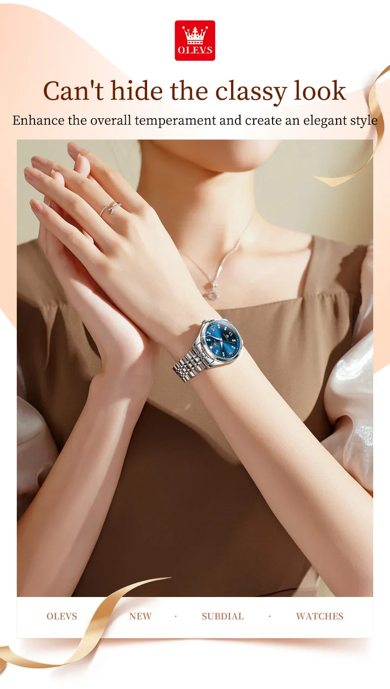 Elegant women's stainless steel watch with a round blue dial and silver link bracelet, worn on a woman's wrist.