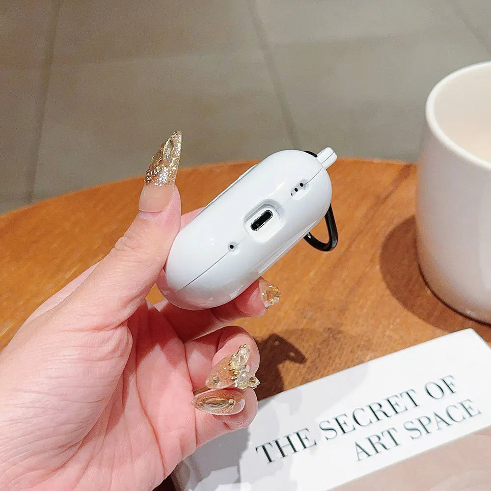 White protective case for AirPods Pro, featuring a sleek finish with a built-in carabiner clip.