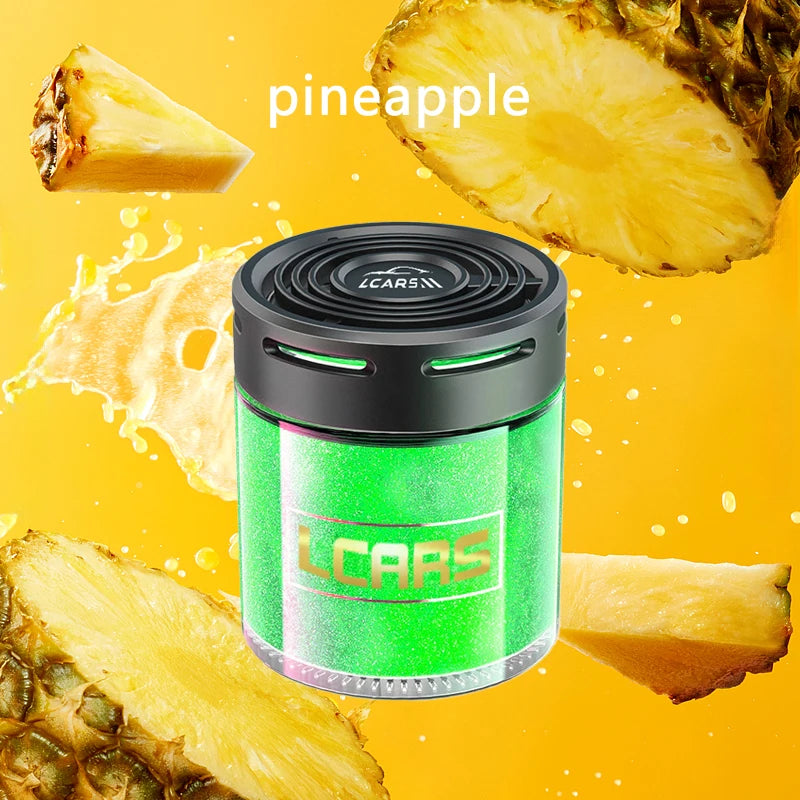 Cylindrical pineapple-scented car air freshener with a black top and vibrant green glitter body on yellow background.