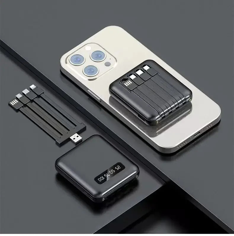 Black mini portable power bank with built-in charging cables and a digital battery percentage display.