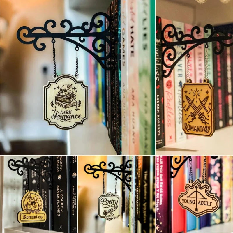 Black scrollwork wall brackets supporting various hanging wooden signs with genre labels like 'Romantasy' and 'Poetry'.