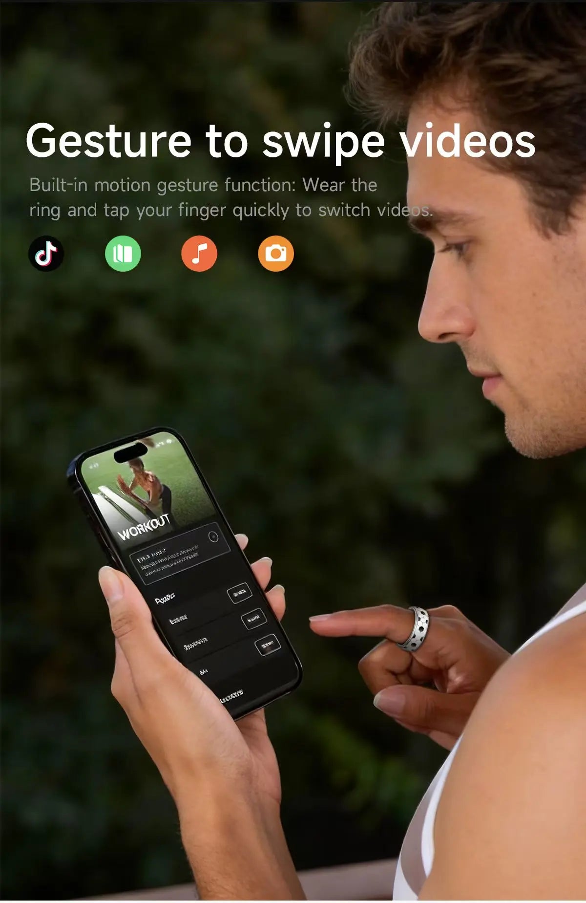 A man wears a sleek, silver smart ring, using gestures to swipe videos on his smartphone.