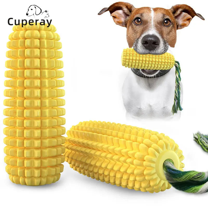 Yellow corn-shaped squeaky dog chew toy with textured kernels and a green and white cotton rope.