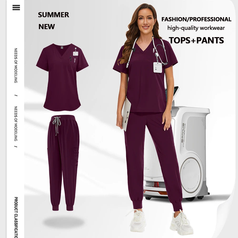 Deep plum unisex scrub set featuring a V-neck top with utility pockets and cuffed trousers with a drawstring waist.