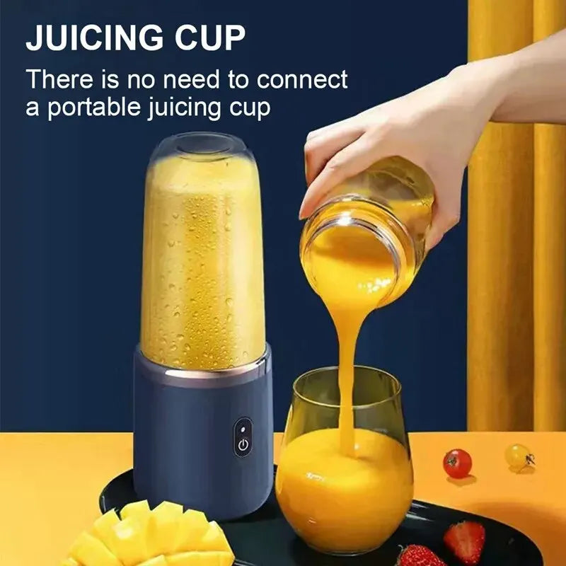 Portable dark blue personal blender pouring orange juice into a glass, with fresh fruit on a tray.