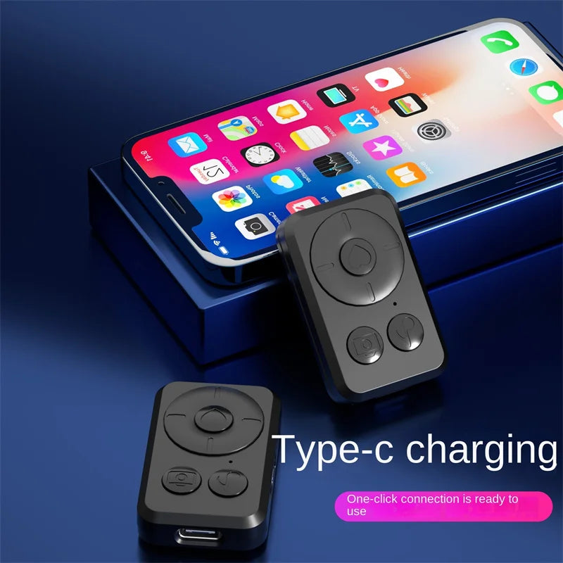 Two black matte plastic remote control clickers for smartphones with camera and directional buttons, featuring USB-C.