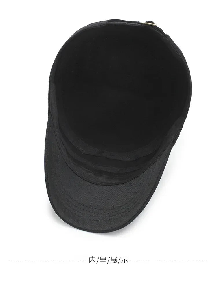 Top-down view of a plain black cotton unisex baseball cap, showing the interior lining and adjustable metal fastener.