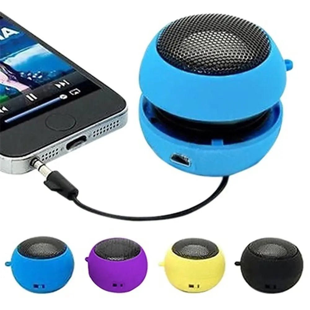 Blue, spherical portable mini speaker connected to a smartphone via 3.5mm jack. Available in four bright colours.