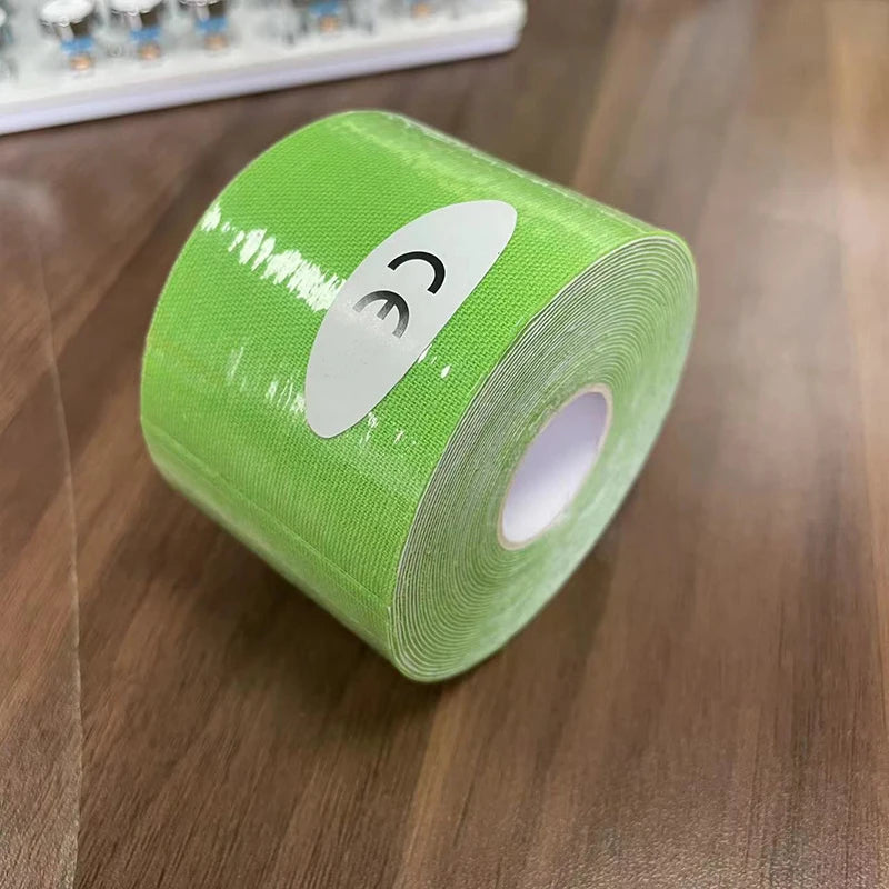 A roll of bright lime green kinesiology sports tape with a CE mark sticker, set on a wooden surface.