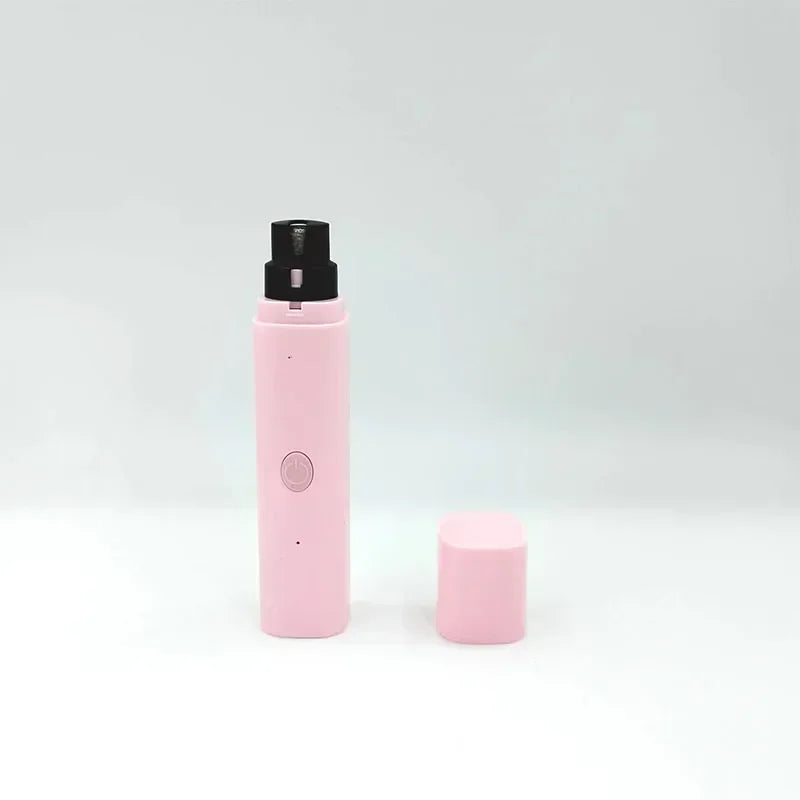 Pastel pink electric pet nail grinder with a black grinding head and a matching protective cap on a white background.