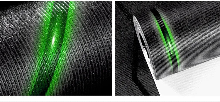 Textured black wallpaper with a vertical ribbed pattern and a striking, reflective green light effect.