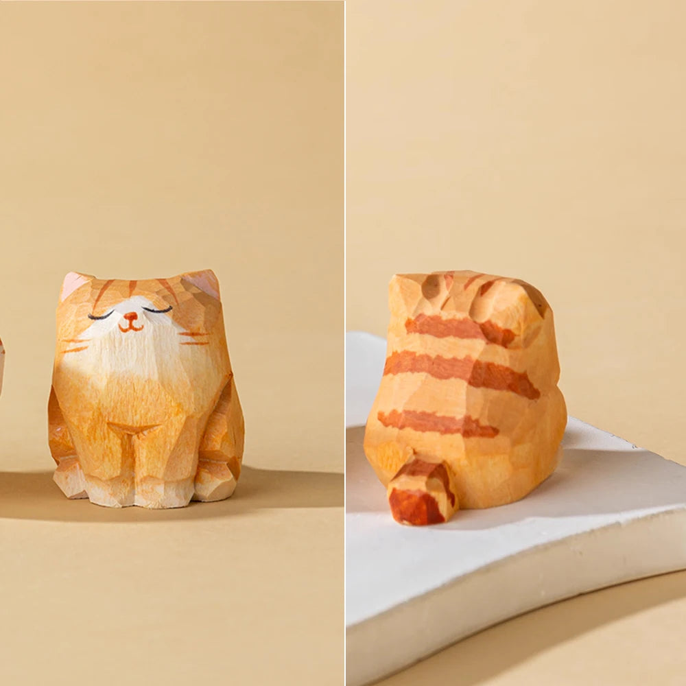Small, hand-carved wooden orange tabby cat figurine with a smiling face and striped back.
