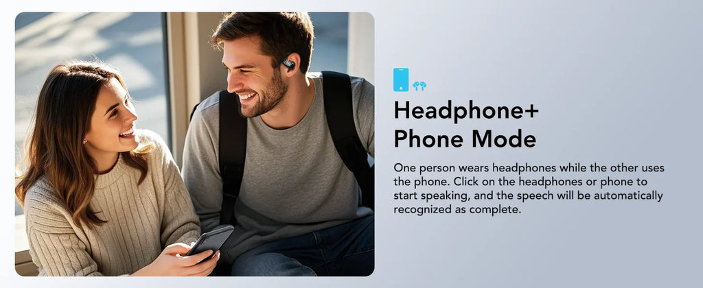 A man wearing sleek, dark wireless earbuds while smiling and interacting with a woman holding a smartphone.
