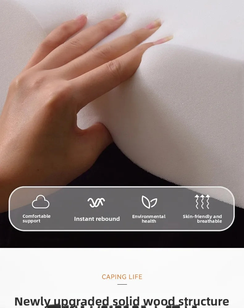 Close-up of a hand pressing into soft, cream-white, high-rebound cushioning for a modern bed frame.