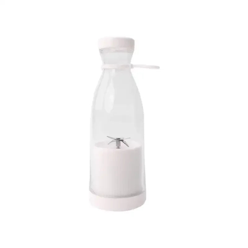 Portable personal blender with a clear bottle, white base, and stainless steel blades. Simple, modern design.