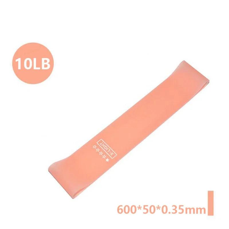 Peach-coloured X-Light resistance band (10lb) measuring 600x50x0.35mm.