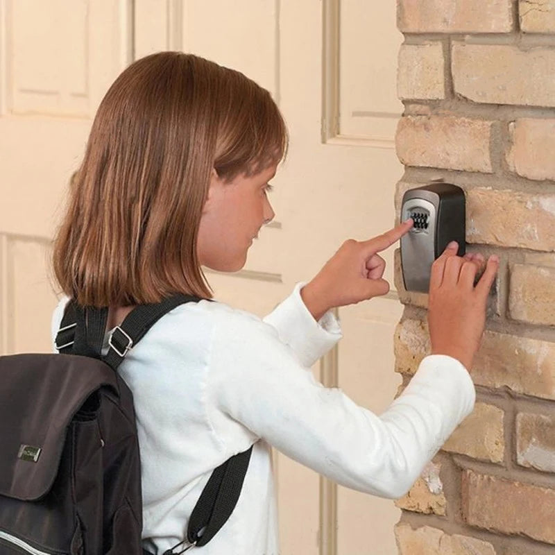 Girl with backpack entering a code on a black, wall-mounted push-button mechanical key lock box.