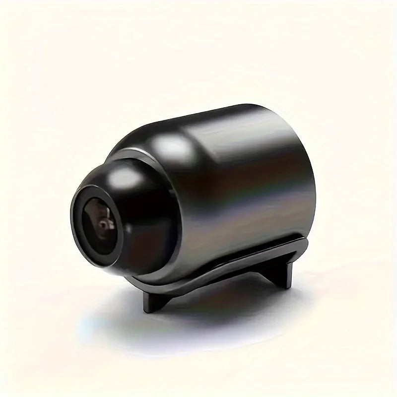 A compact, sleek black wireless security camera with a built-in stand, designed for clear home surveillance.