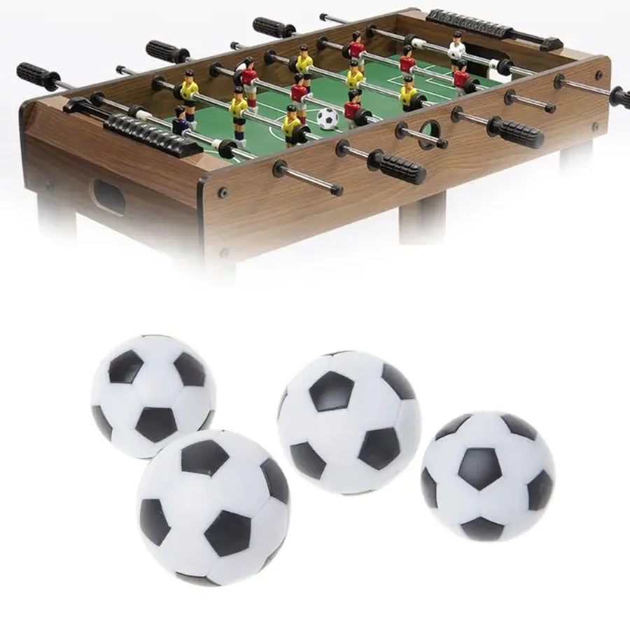 Wood-finish foosball table with players and rods, plus four black and white footballs.