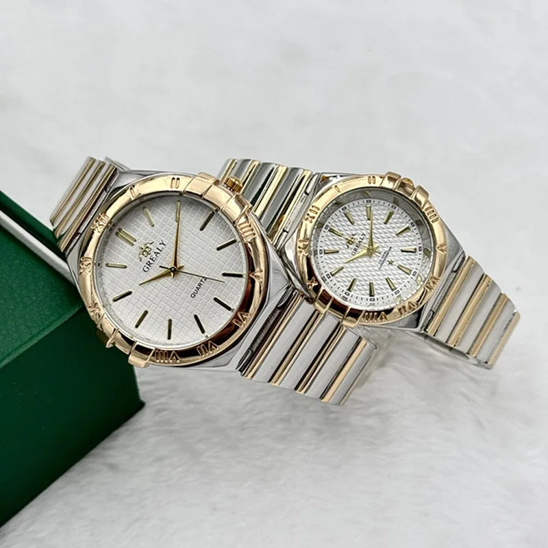 Two gold and silver quartz watches with textured white dials and linked steel straps.